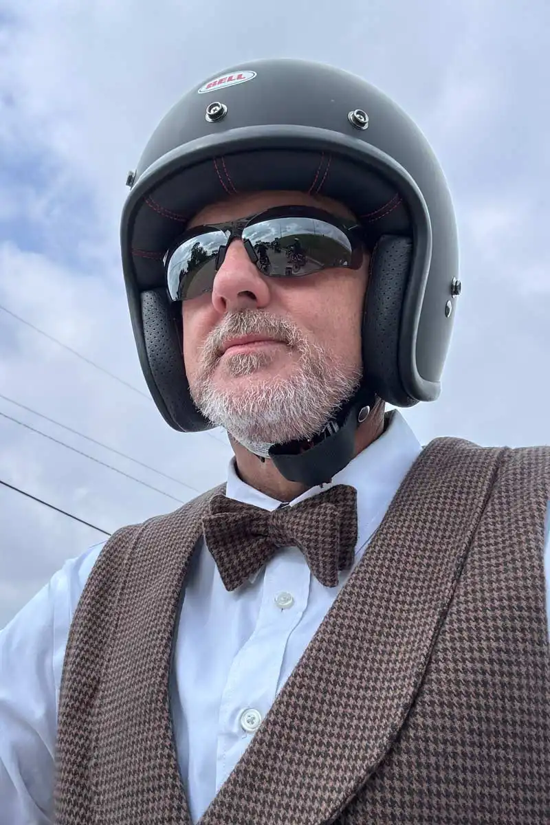 ChrispyWood dressed dapper with an open-faced motorcycle helmet.